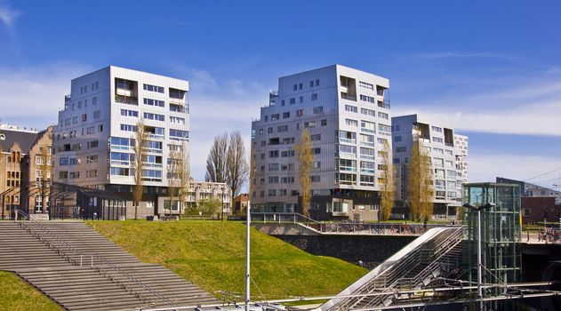 Business district of Amsterdam. Office buildings against the blue clear sky.