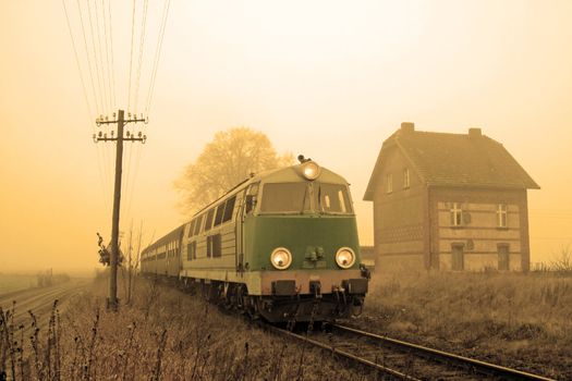 Passenger train passing through countryside
