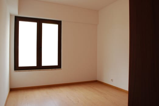 empty room with window and wooden floor