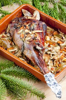venison rump baked on vegetables with bay leaf and Jamaica pepper