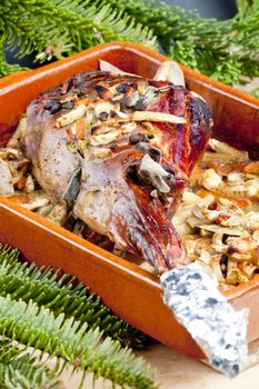 venison rump baked on vegetables with bay leaf and Jamaica pepper