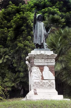 A old roman statue on stone and brick stand: Rome, Italy