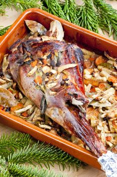 venison rump baked on vegetables with bay leaf and Jamaica pepper