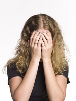 Portrait of a woman with her hands over the face