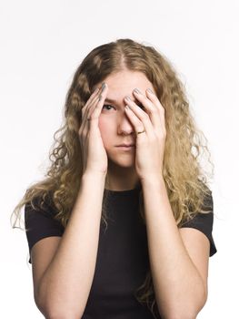 Portrait of a serious woman playing peek-a-boo