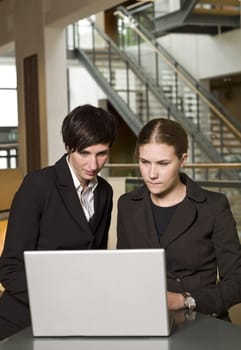 Two women in front of a laptop