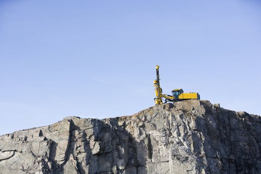 Crane on a mountain towards blue sky