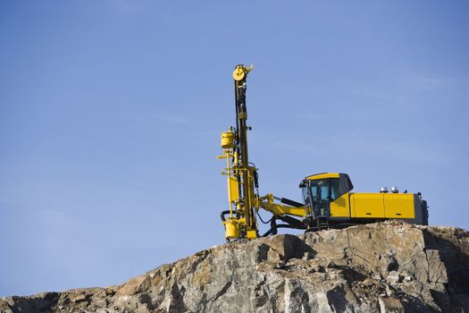 Crane on a mountain towards blue sky