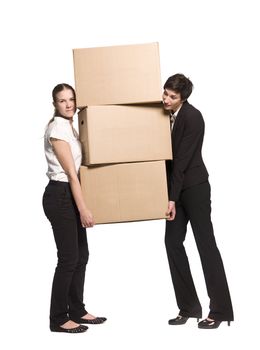 Two women carrying three boxes