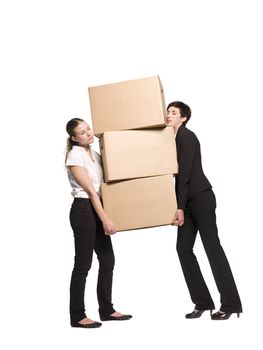 Two women carrying three boxes