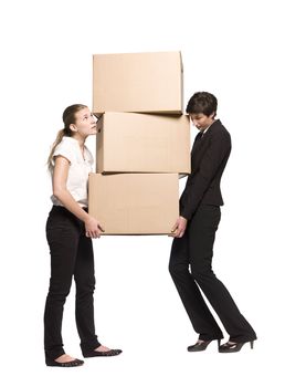 Two women carrying three boxes