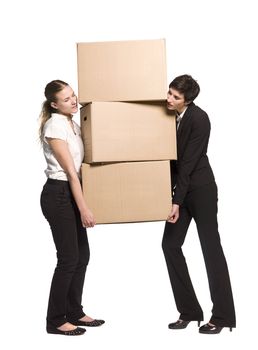 Two women carrying three boxes