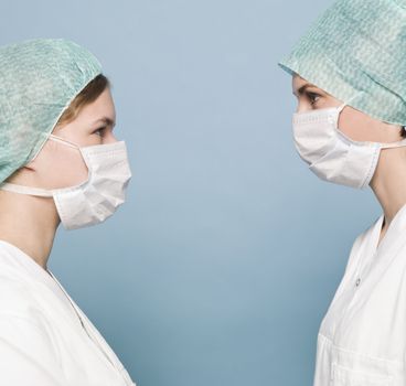 Two nurses with surgical masks