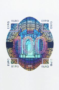Closeup photo of the hologram of a hundred euro note. Macro photo.