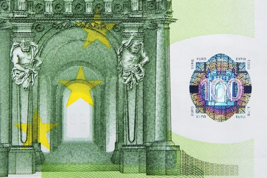 Closeup photo of a part of one hundred euro note including hologram. Macro photo.