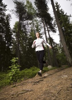 Woman running in the woods