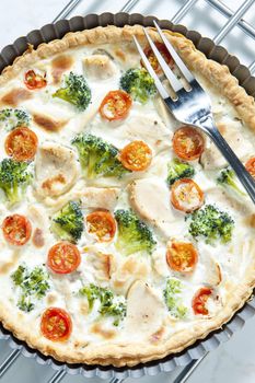 cake with broccoli, cherry tomatoes and chicken meat