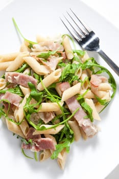 penne pasta with Parma ham and ruccola