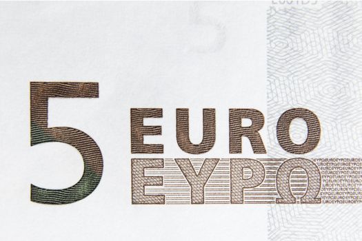 Closeup photo of a part of five euro note. Macro photo.