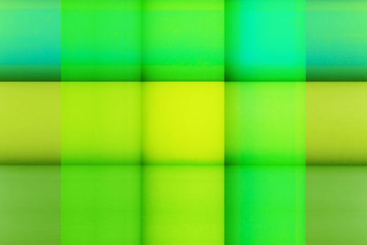 Closeup photograph of color squares. Green hues.