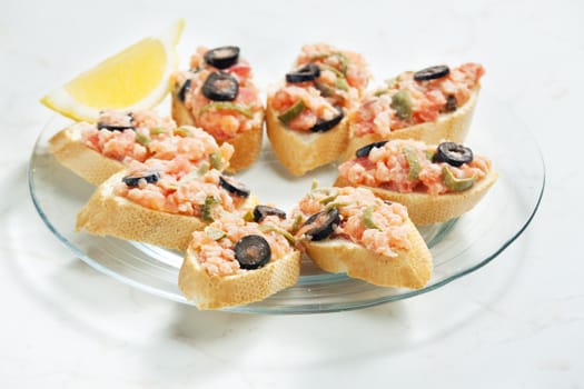 salmon tartare with capers and black olives