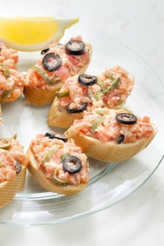 salmon tartare with capers and black olives