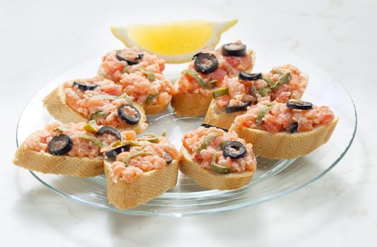 salmon tartare with capers and black olives