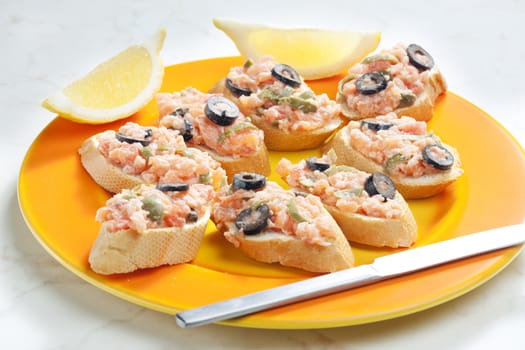 salmon tartare with capers and black olives