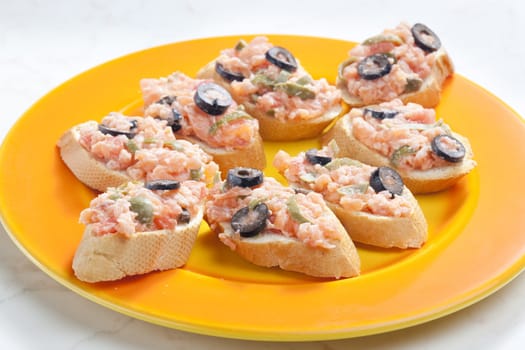 salmon tartare with capers and black olives