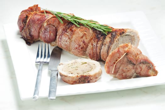 veal roll filled with minced beef meat and herbs