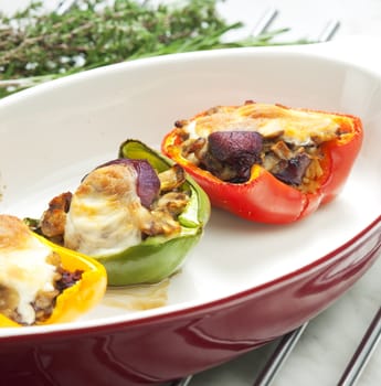 peppers filled with champignons and chicken livres baked with mozzarella cheese