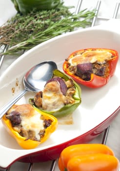 peppers filled with champignons and chicken livres baked with mozzarella cheese