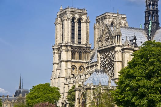 Notre Dame de Paris. A fragment of the towers against the blue clear sky. Paris, France.