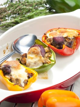 peppers filled with champignons and chicken livres baked with mozzarella cheese