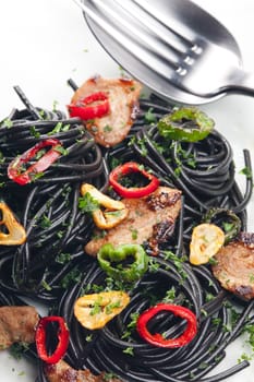 sepia spaghetti with turkey meat and chilli