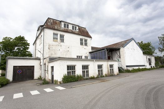 Old and angular white building in Hanko.