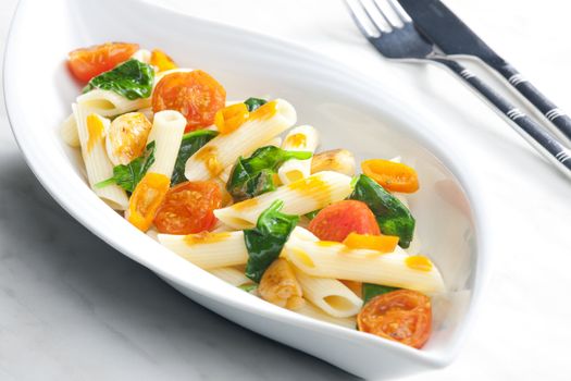 pasta penne with spinach and cherry tomatoes