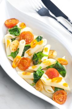 pasta penne with spinach and cherry tomatoes