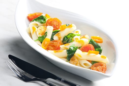 pasta penne with spinach and cherry tomatoes