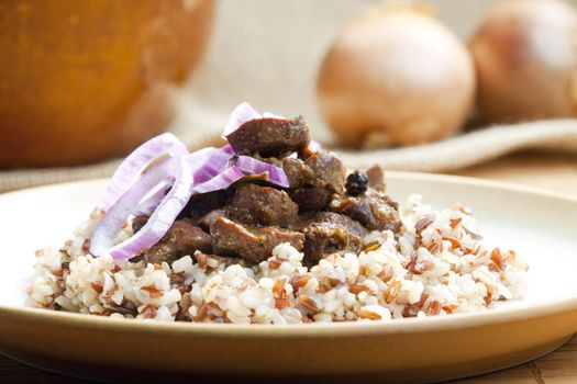 pork kidney on onion with wild rice