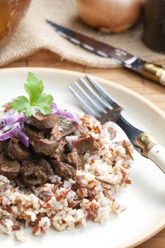 pork kidney on onion with wild rice