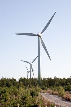 Modern windmill producing renewable energy ecologically.