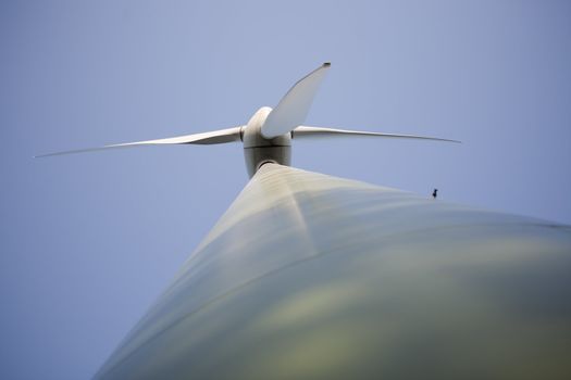 Modern windmill producing renewable energy ecologically.