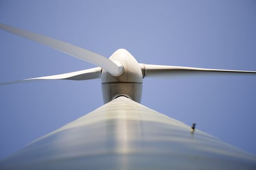 Modern windmill producing renewable energy ecologically.