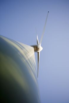 Modern windmill producing renewable energy ecologically.