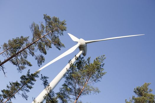 Modern windmill producing renewable energy ecologically.
