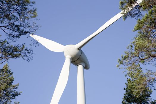 Modern windmill producing renewable energy ecologically.