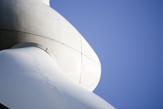 Modern windmill producing renewable energy ecologically.