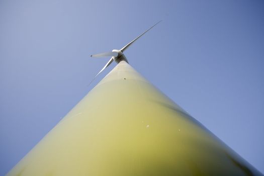 Modern windmill producing renewable energy ecologically.