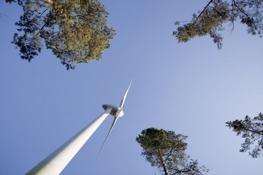 Modern windmill producing renewable energy ecologically.